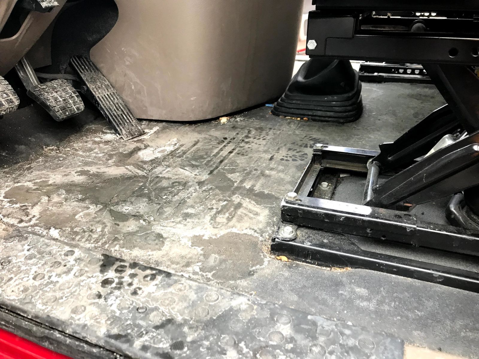Dirty fleet truck cab floor before fleet cleaning by Gilbert Auto Detail